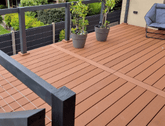 Light Brown Composite Plastic Deck with Hand Railings