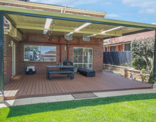 CleverDeck Xtreme Rustic Merbau 138mm wide decking installed using a low height aluminium subframe over old pavers in a suburban backyard