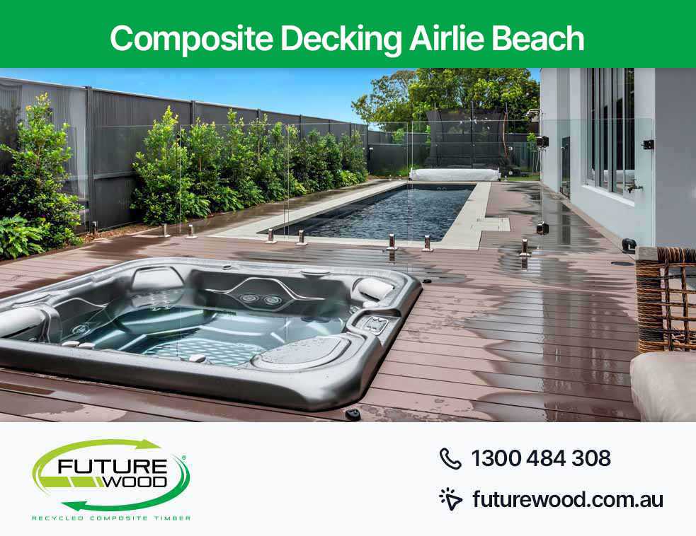 Image of hot tub and pool combo, nestled on a composite deck boards in Airlie Beach
