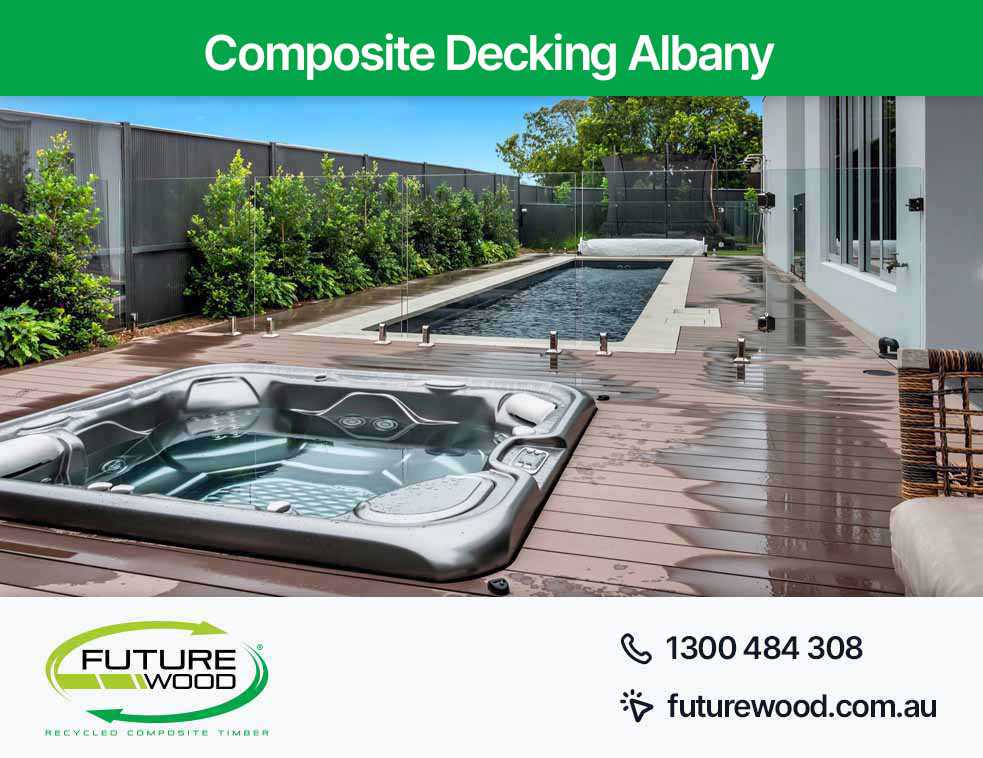 Image of hot tub and pool combo, nestled on a composite deck boards in Albany