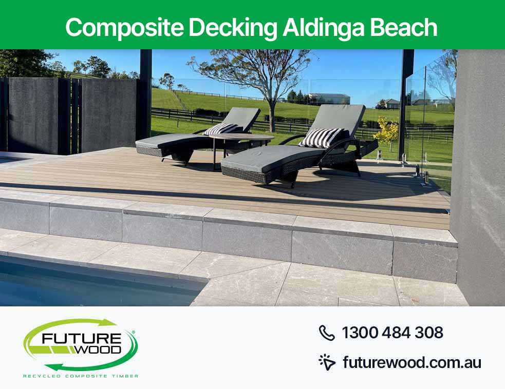 Picture of a pool in Aldinga Beach surrounded by lounge chairs and a floor made of composite decking boards