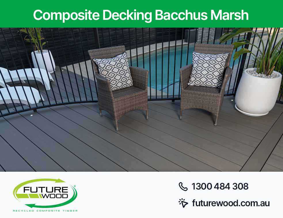 Picture of wicker chairs on a composite deck boards, overlooking a pool in Bacchus Marsh
