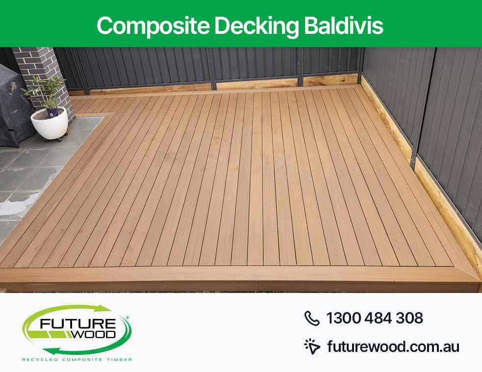 Image of composite deck boards on patio with black wall in Baldivis