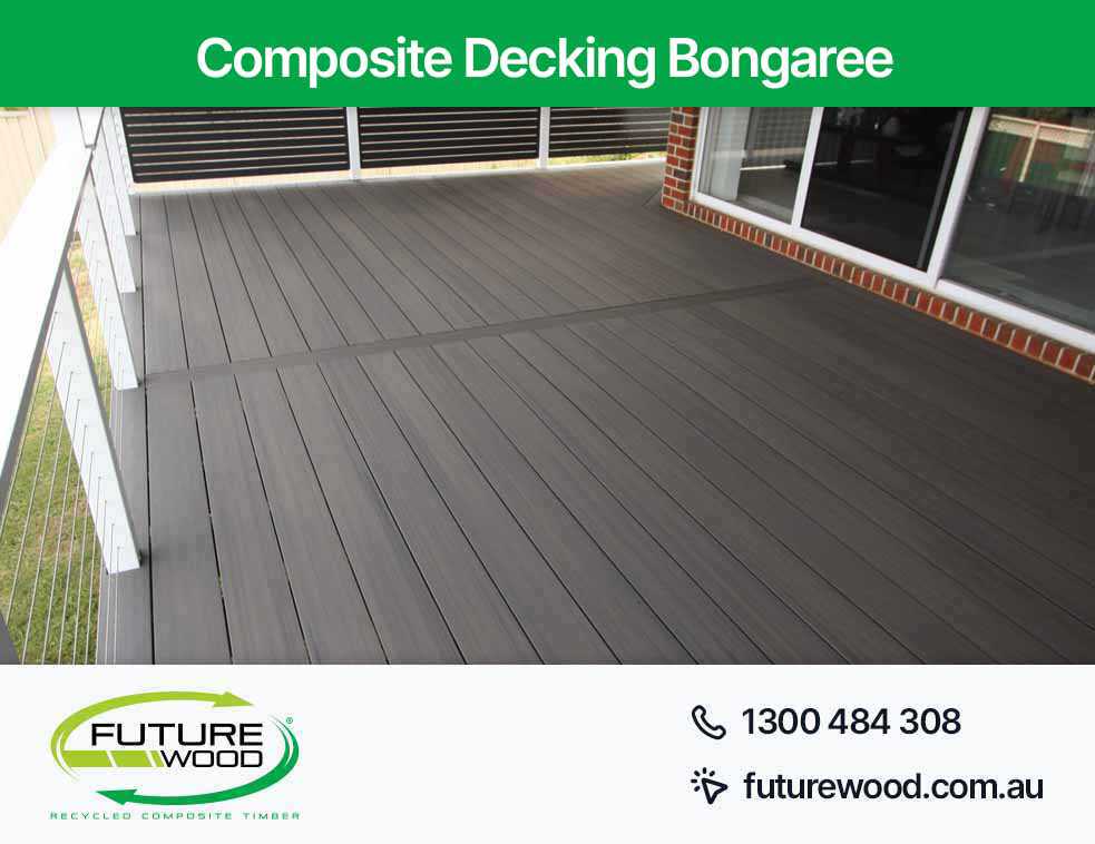 A deck made with composite decking boards, with a railing in Bongaree