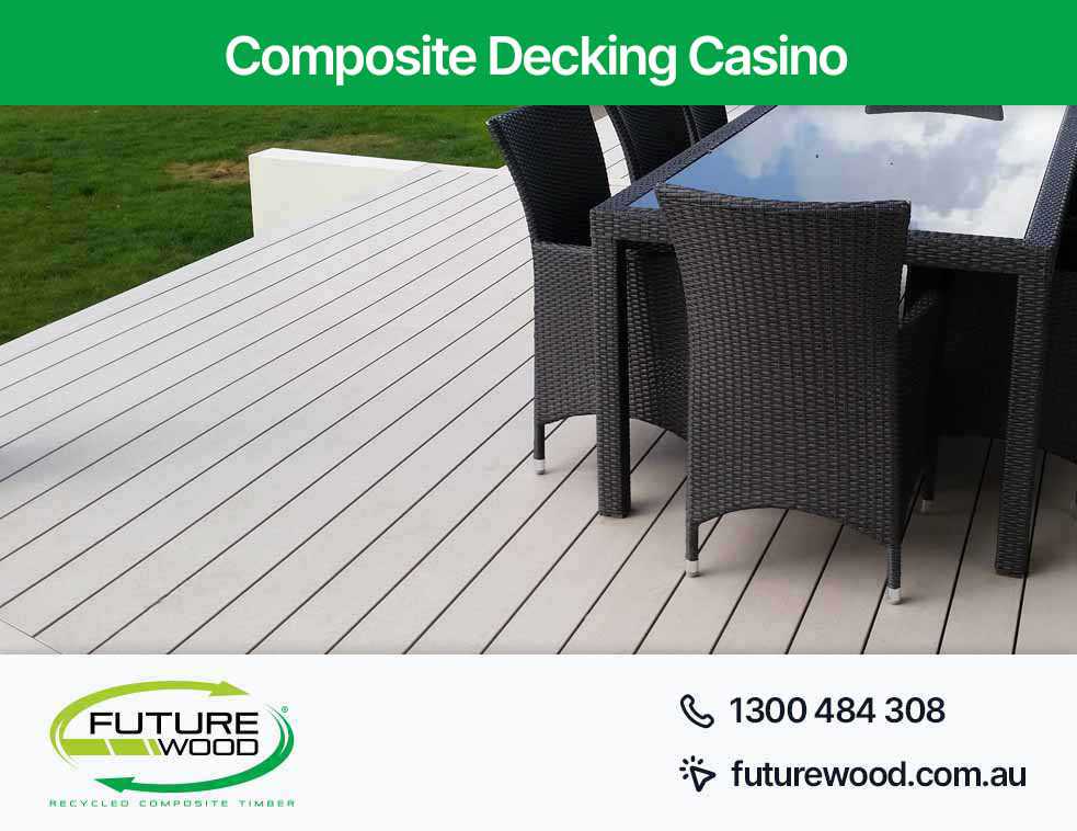 Image of composite deck boards with chairs and a table in Casino