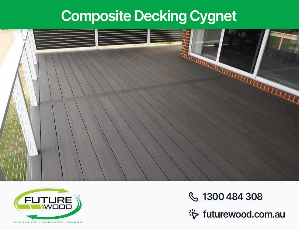A deck made with composite decking boards, with a railing in Cygnet