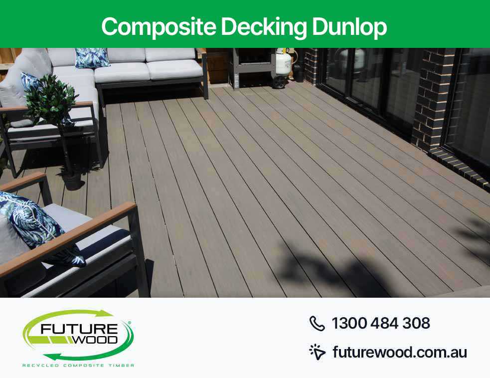 Picture of composite deck boards with stylish furniture and outdoor patio in Dunlop