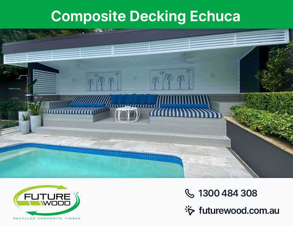 Blue and white cushions by a pool in Echuca, with composite decking boards as the backdrop