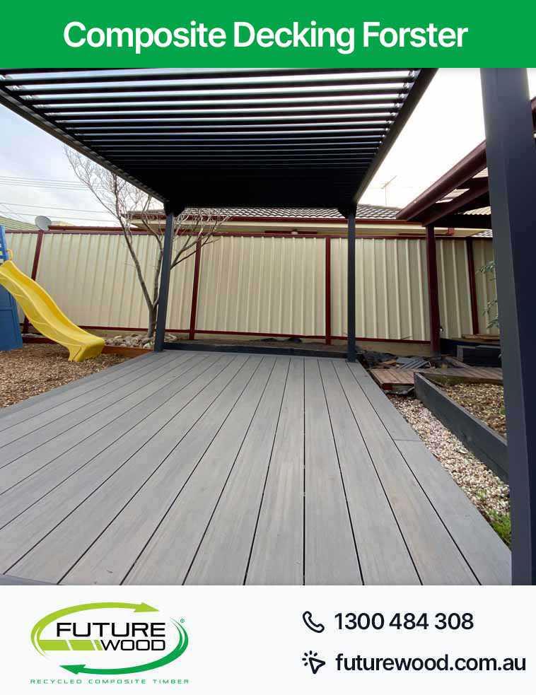 Image of deck featuring composite decking boards and a metal pergola in Forster