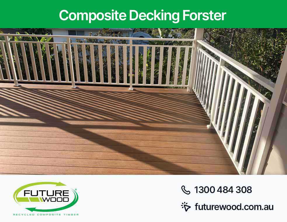 Image of white railings on a deck made of composite decking boards in Forster