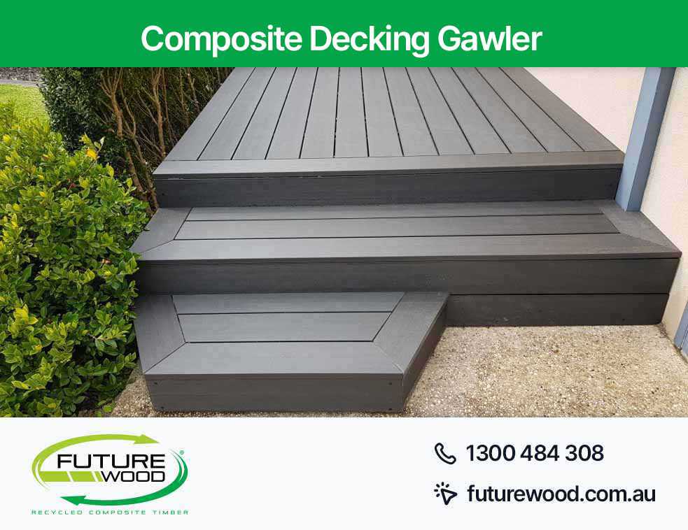Black decking boards with steps made of composite material in Gawler