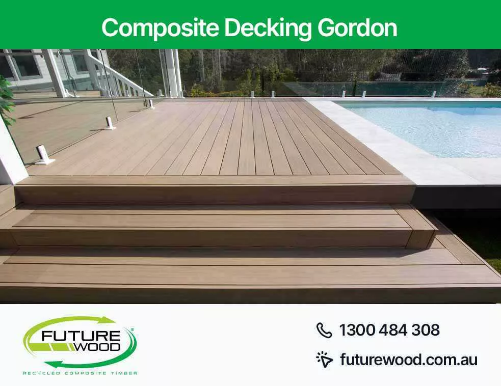 Picture of composite decking boards on a deck with steps leading to a pool in Gordon