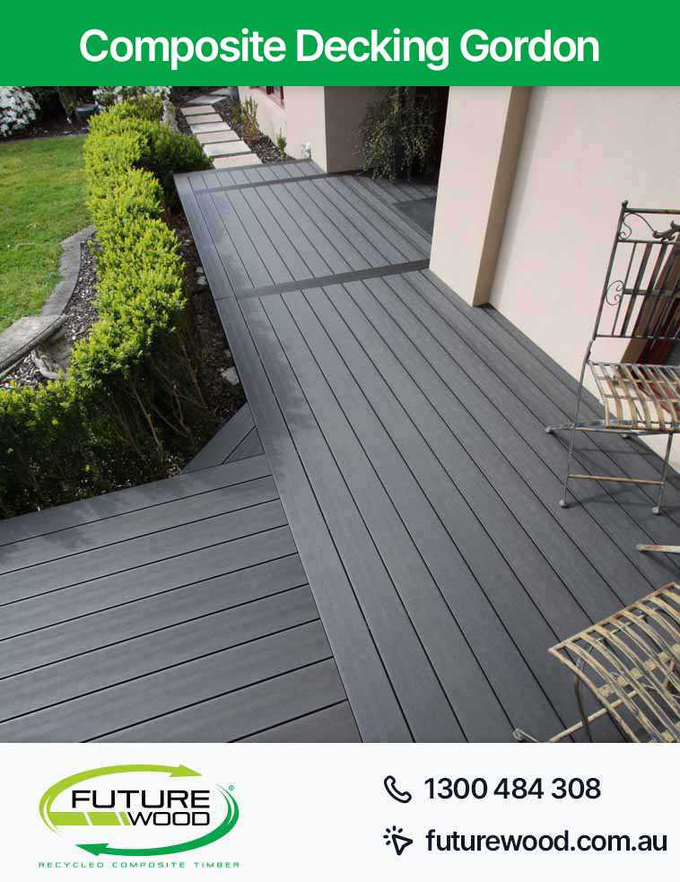 Picture of a deck made of composite deck boards near the garden in (Suburb)