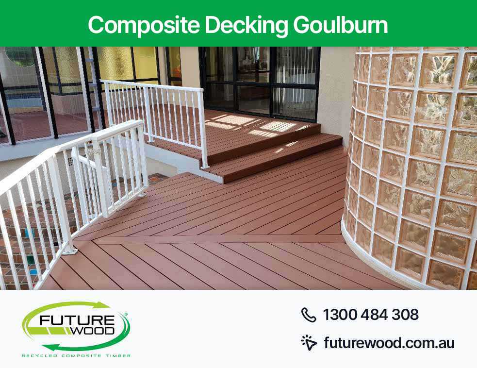 Image of a composite deck boards featuring a white railing in Goulburn