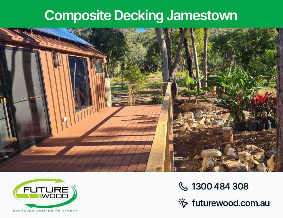 A deck made up of eco-friendly composite decking boards featuring a solar panel in Jamestown