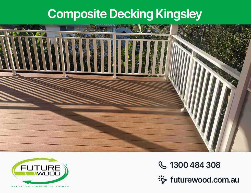 A deck in Kingsley made of composite deck boards featuring white railings