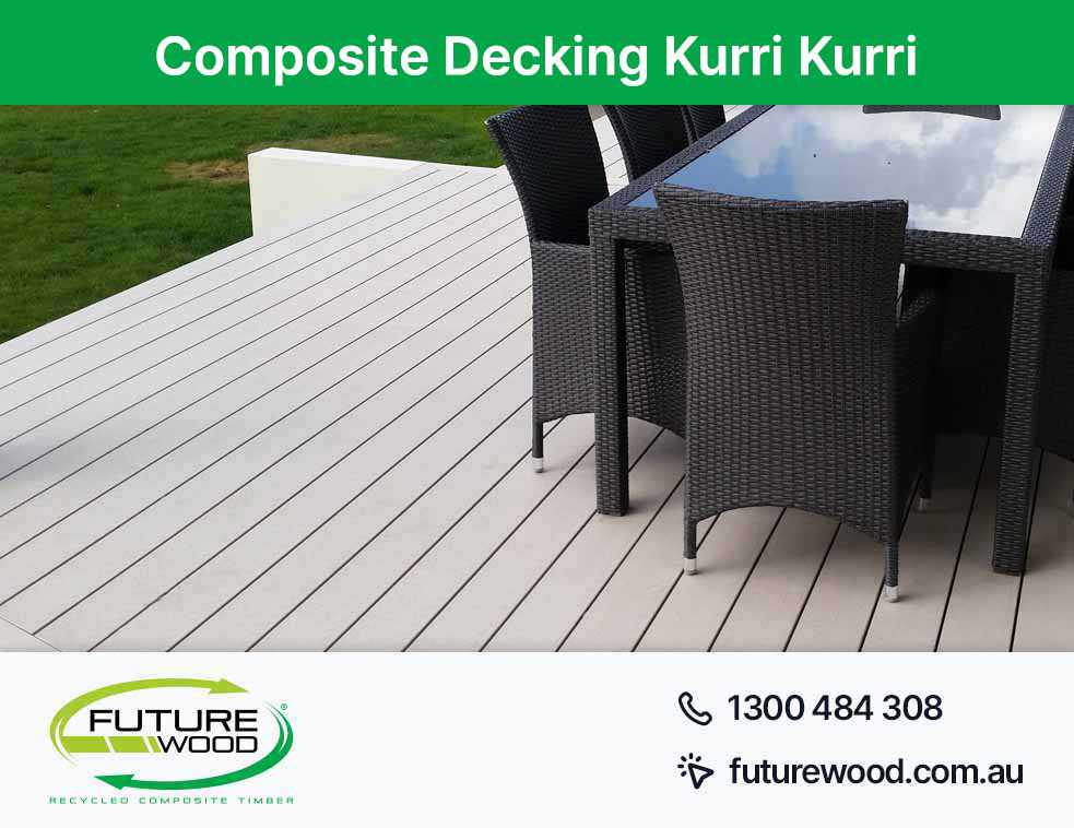 A scenic deck with chairs and a table, made of composite decking boards in Kurri Kurri