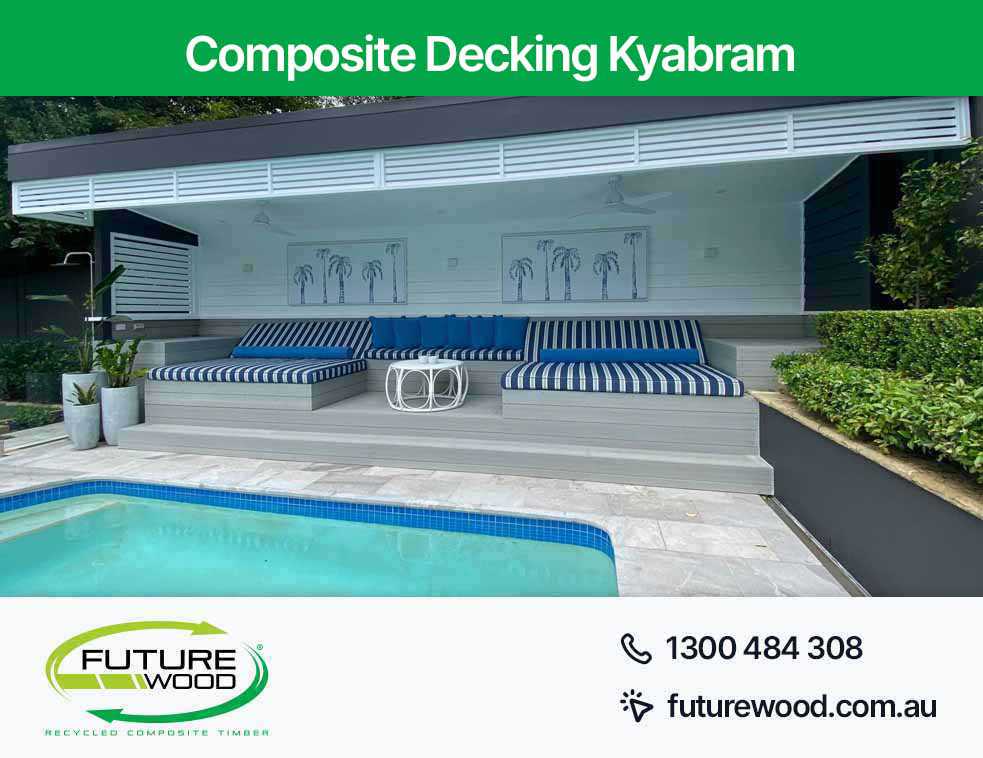 Picture of a pool with blue and white cushions in Kyabram surrounded by composite decking boards