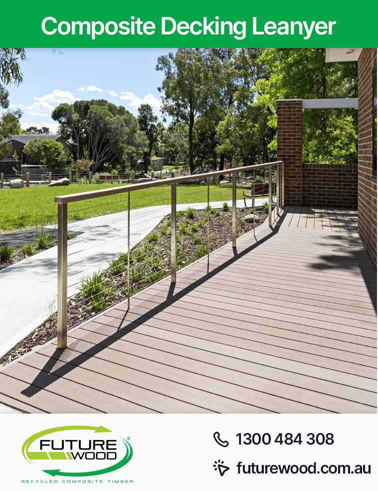 Image of a walkway made of composite deck boards in (Suburb) featuring a railing