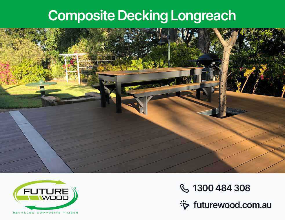 A picnic area in Longreach on a deck with composite decking boards, benches and a table