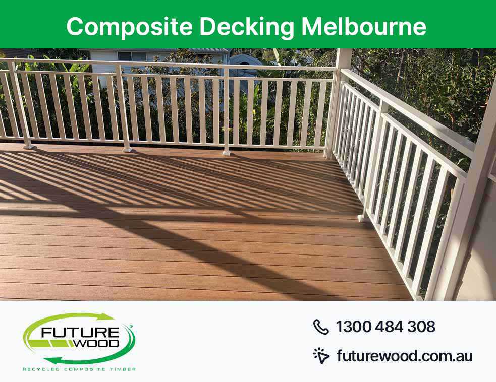 A deck in Melbourne made of composite deck boards featuring white railings