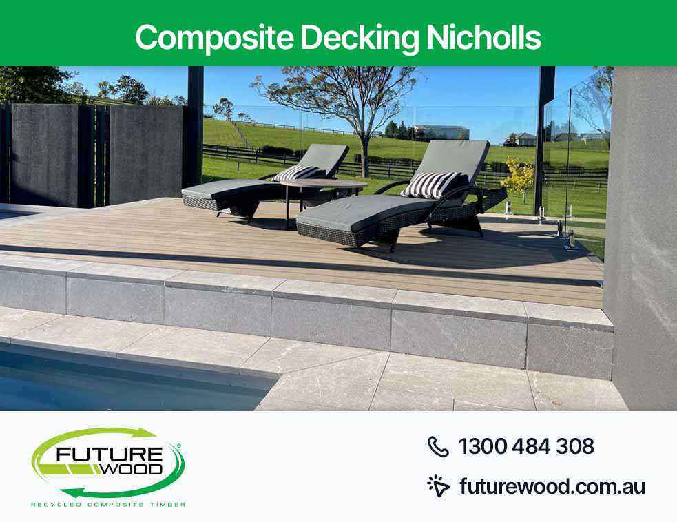 Relaxation by the pool on lounge chairs with flooring made of composite deck boards in Nicholls