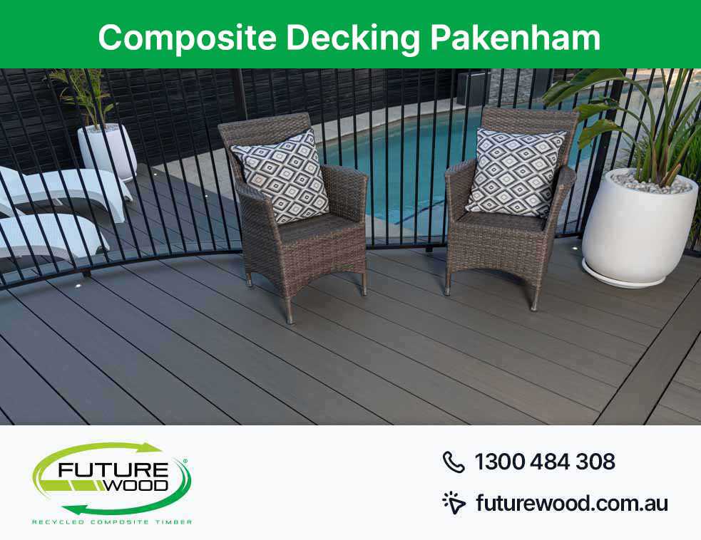 Image of a poolside view of two wicker chairs on a composite decking boards in Pakenham