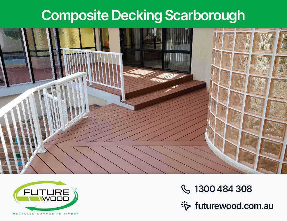 Photo of a deck made of composite decking boards in Scarborough, with a white railing