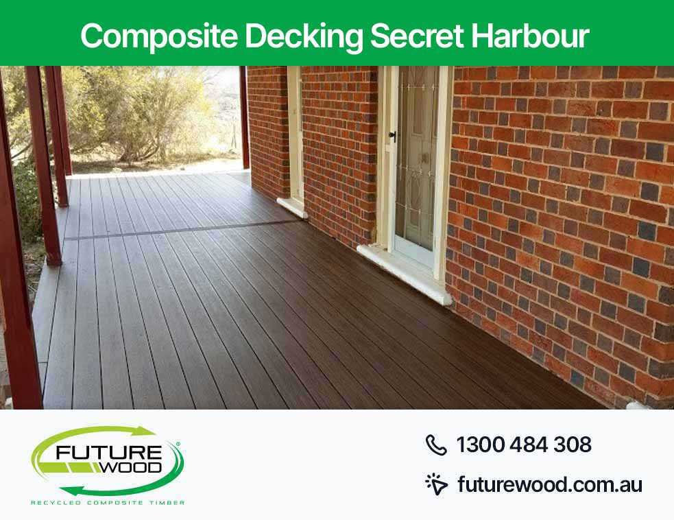 A stylish combination of composite deck boards, brick patio, and wall in Secret Harbour