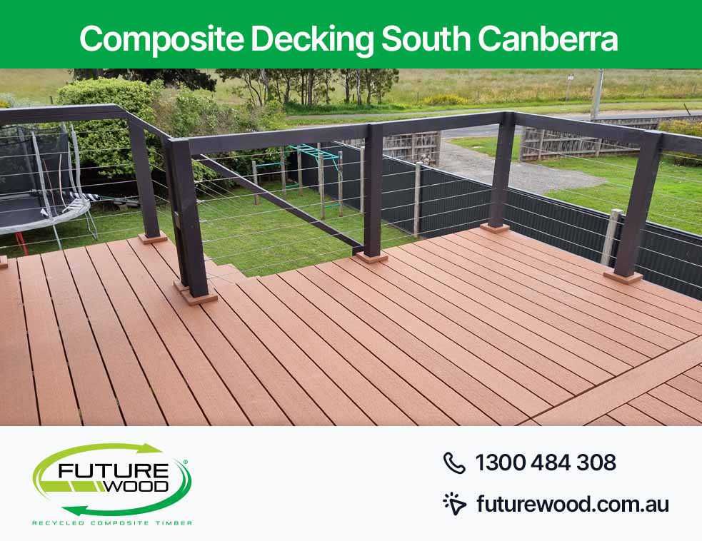 A deck made of composite decking boards, railing and fence in South Canberra