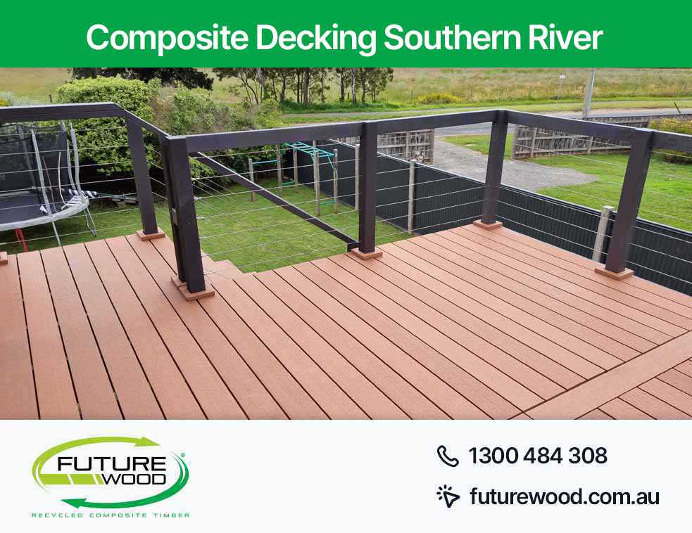 A balcony made of composite decking boards with railing and fence in Southern River