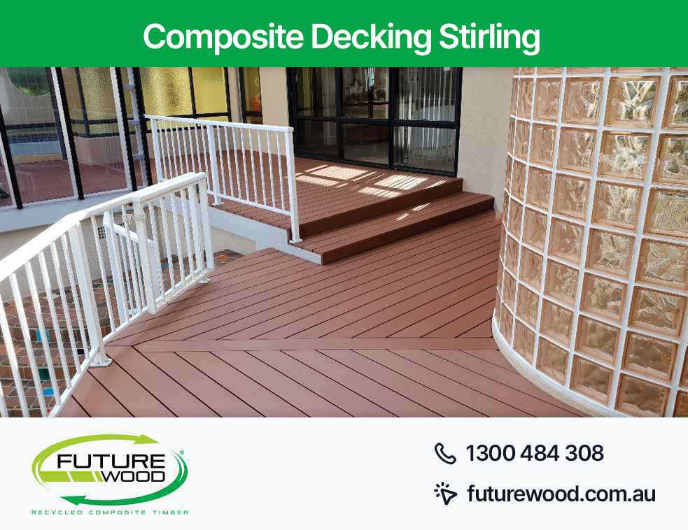 Picture of a composite deck boards with a white railing in Stirling