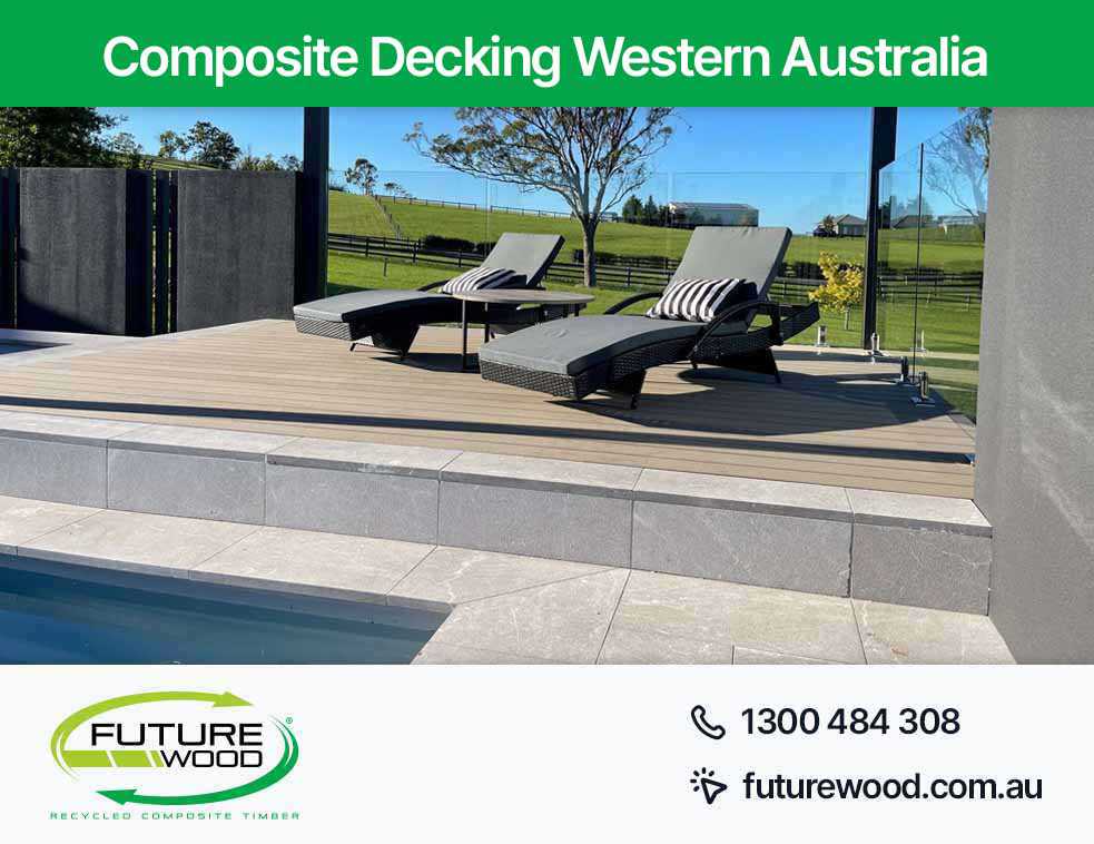 Relaxation by the pool on lounge chairs with flooring made of composite deck boards in Western Australia