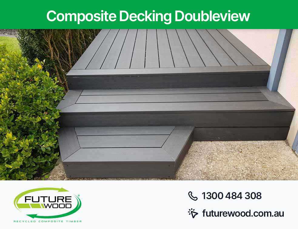 Black decking boards with steps made of composite material in Doubleview