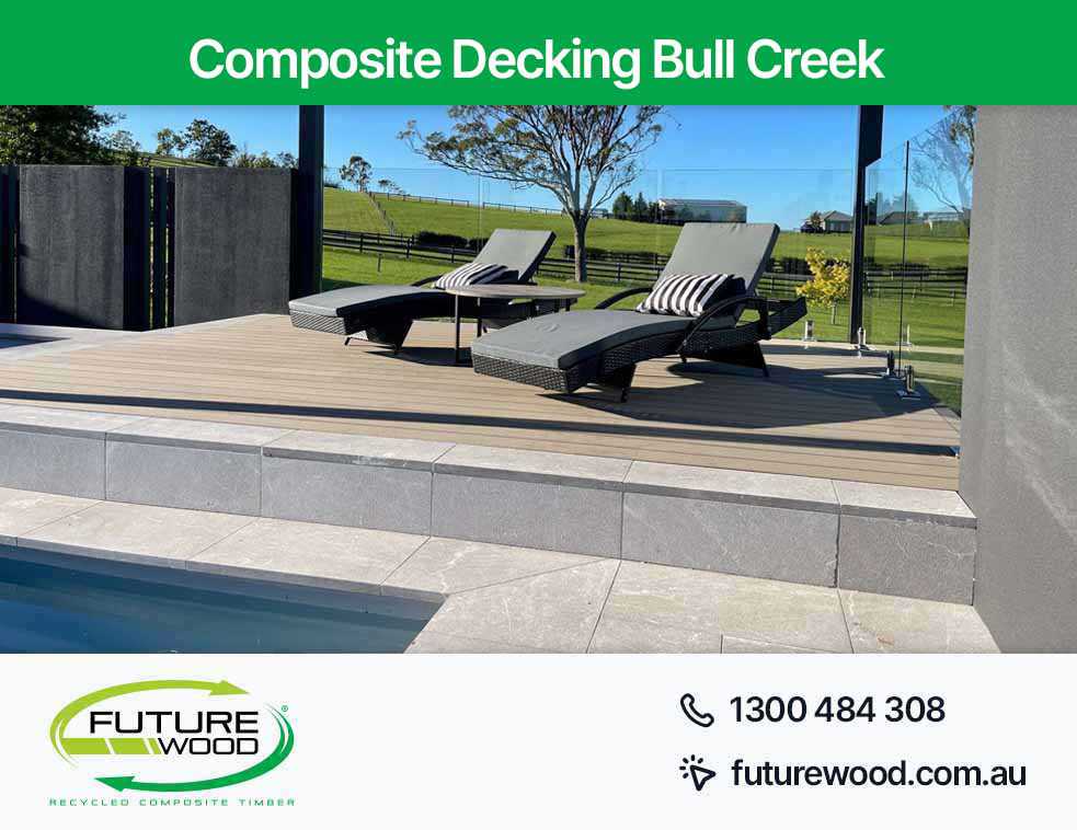 Picture of a pool in Bull Creek surrounded by lounge chairs and a floor made of composite decking boards