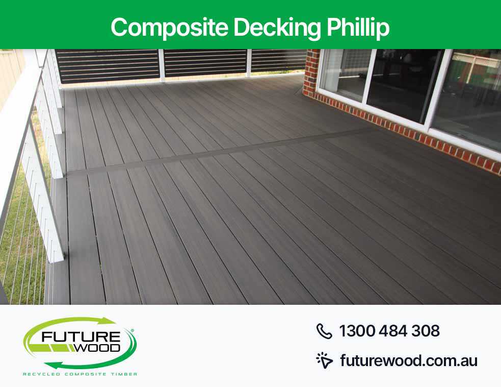 A deck made with composite decking boards, with a railing in Phillip